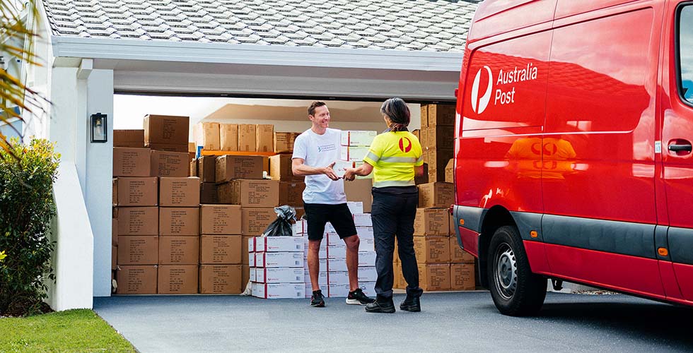 australia post delivery driver giving package to customer